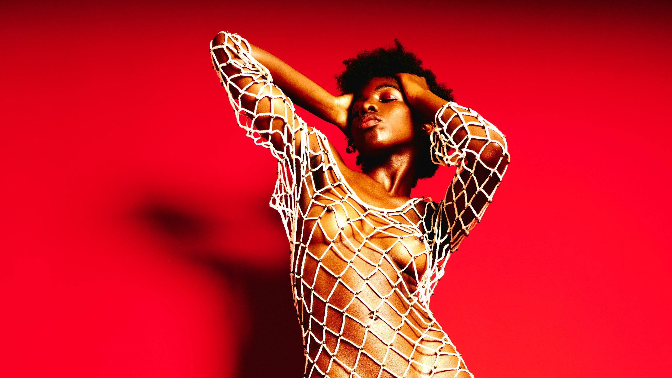 Lucia Bindang in Red by Kenneth Svendlund