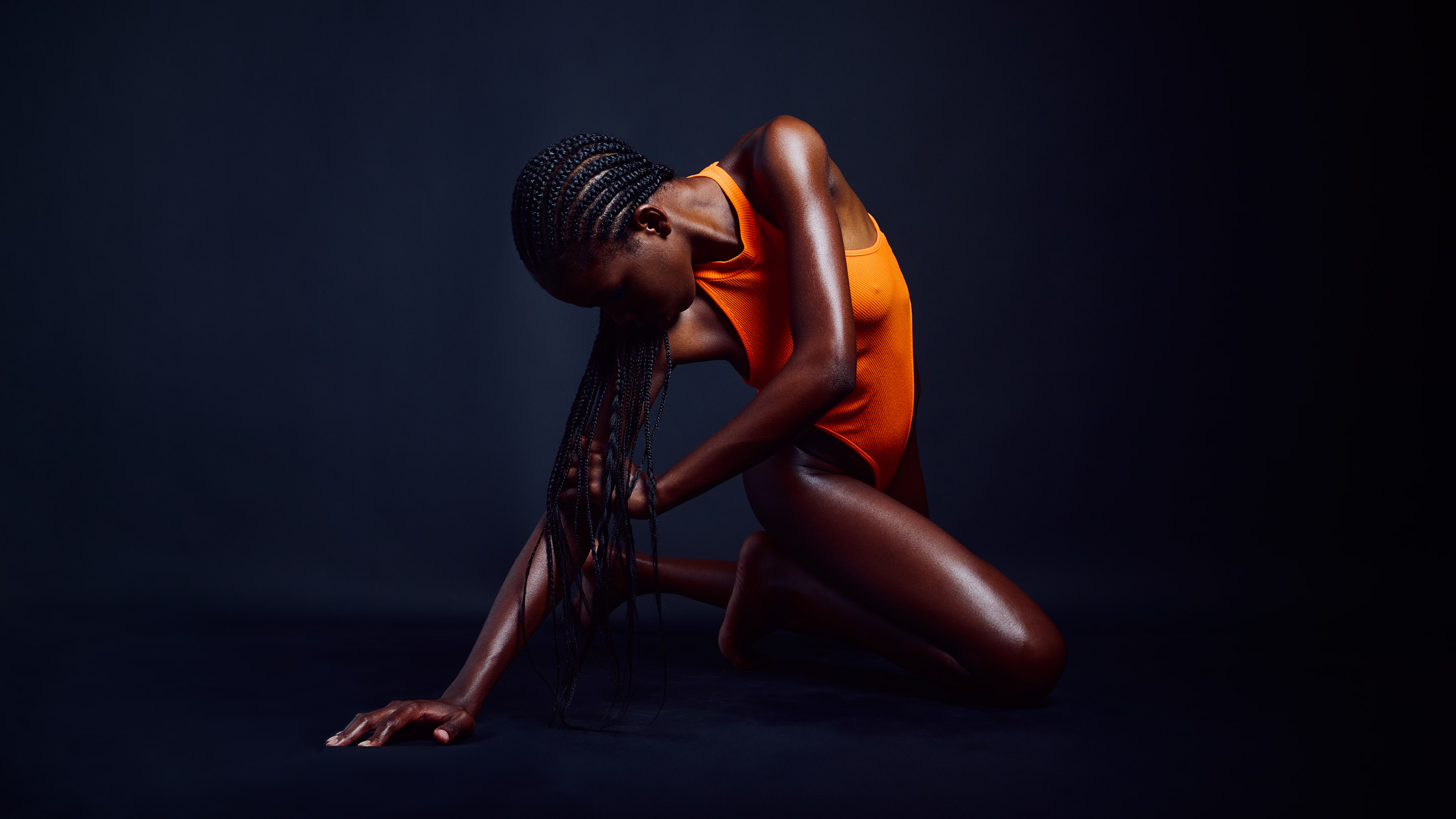 Lucia Bindang in Orange Black by Kenneth Svendlund